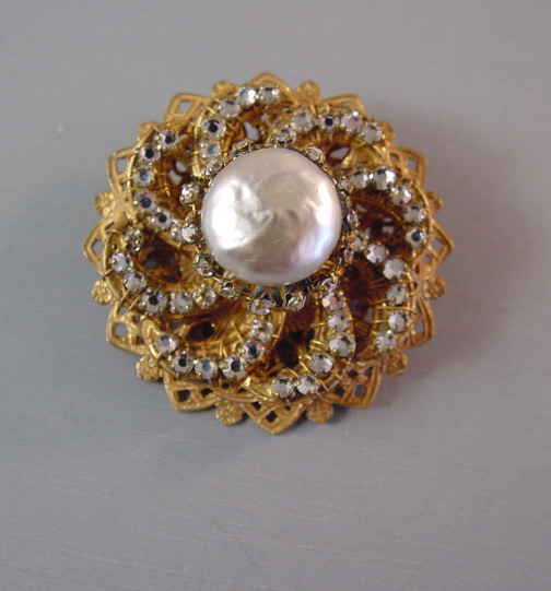 MIRIAM HASKELL brooch with a mabe pearl-looking glass center