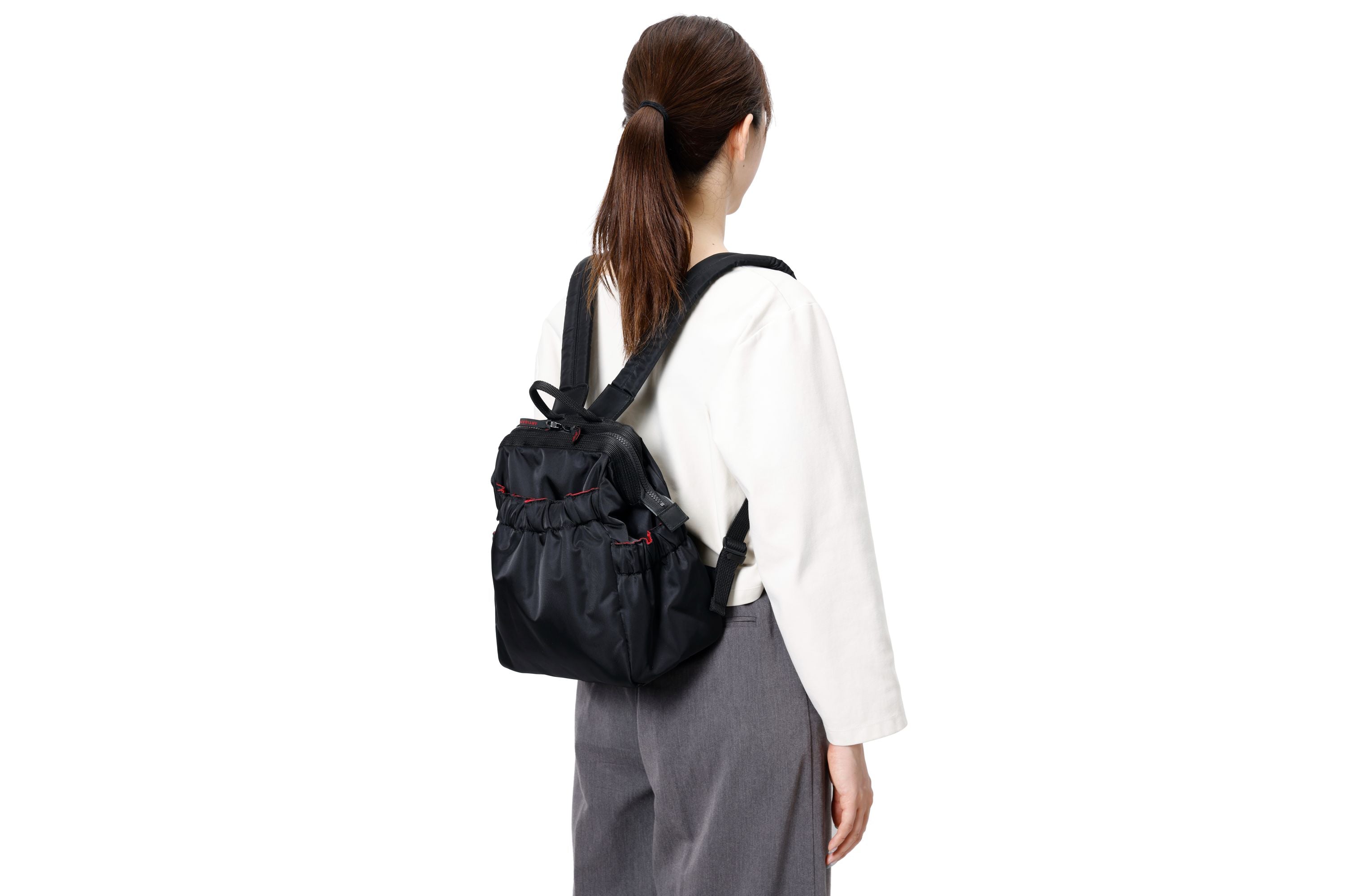 Compact backpack with wide clasp opening