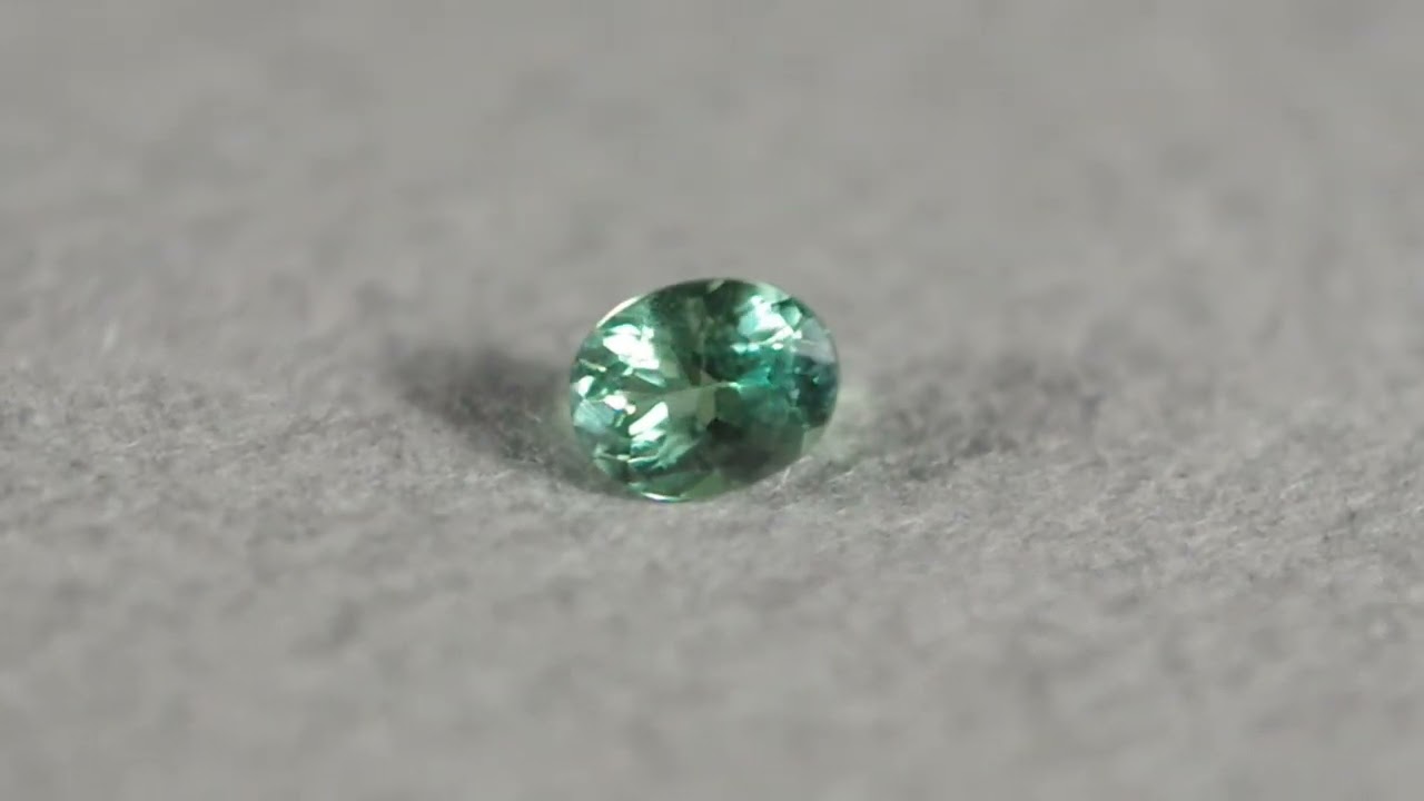 蛍光グリーンアウイナイト 0.084ct 鑑別書UVペン付