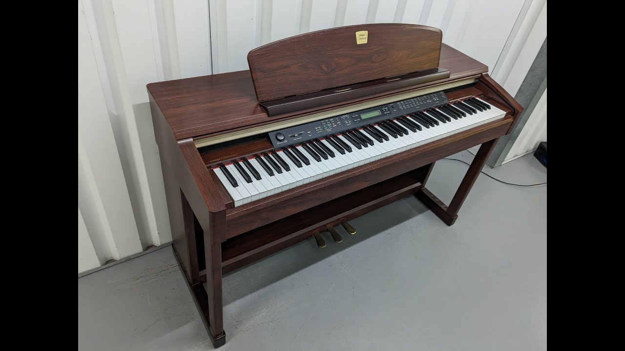 Yamaha Clavinova CLP-150 digital piano in mahogany finish stock