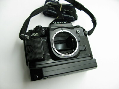 Canon A-1 film camera body with Genuine strap and Power Winder A2