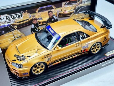 IG3799 – 1/18 TOP SECRET 34GT-R (BNR34) Gold Comes with RB26