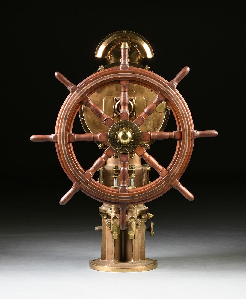 A SCOTTISH MAHOGANY SHIP'S WHEEL ON POLISHED BRASS STEERING