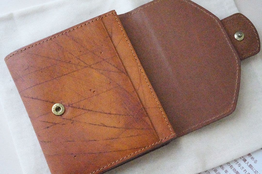 ゲンテン エクバターナ 三つ折り財布 コニャック