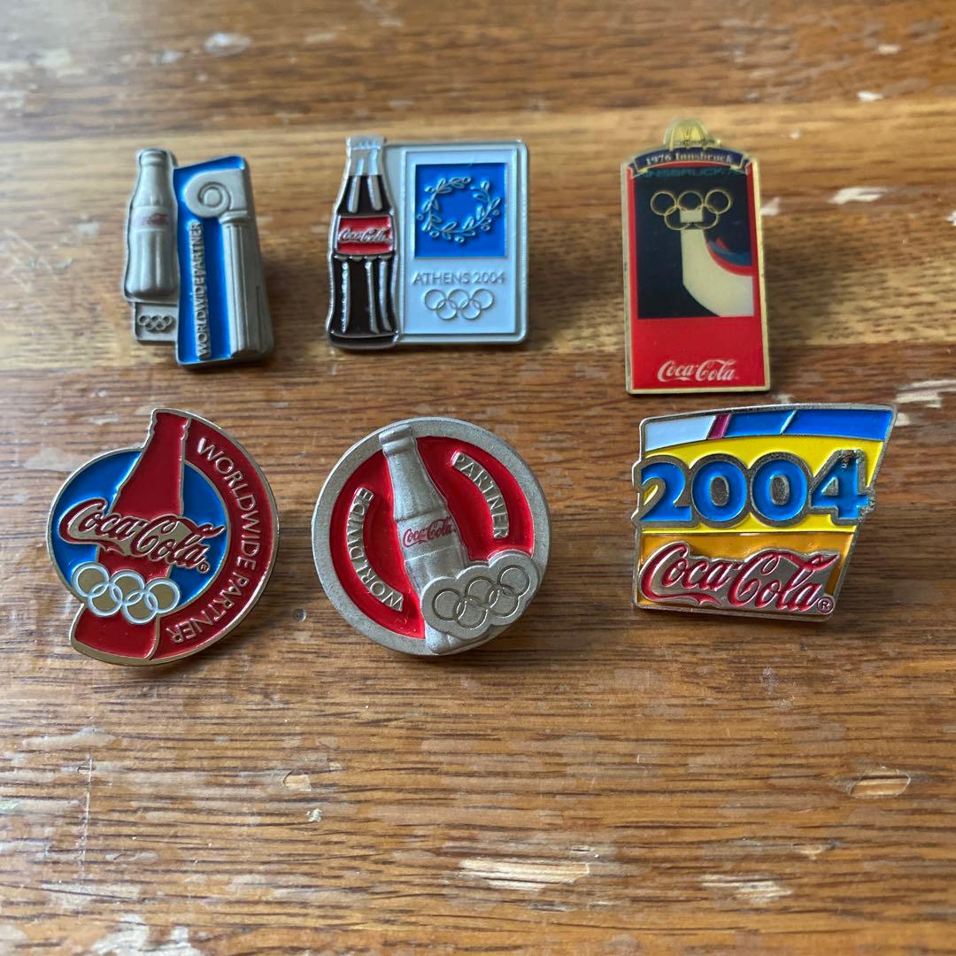 コカコーラとオリンピックのコラボピンバッジ - メルカリ