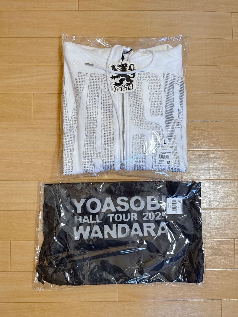 新品【YOASOBI】ジップアップパーカー ホワイト L ナップサック - メルカリ