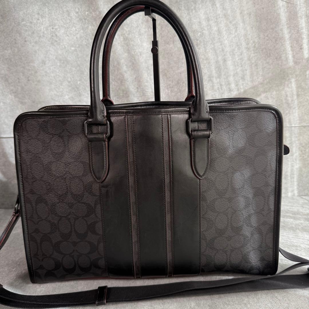 良品 コーチ ビジネスバッグ A4収納可 シグネチャー F23212