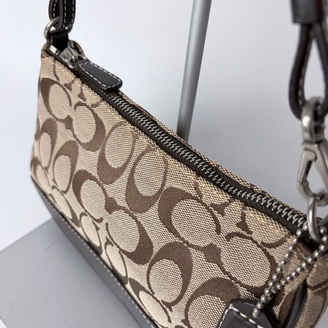 コーチ アクセサリーポーチaccessory pouch6094チャームブラウン