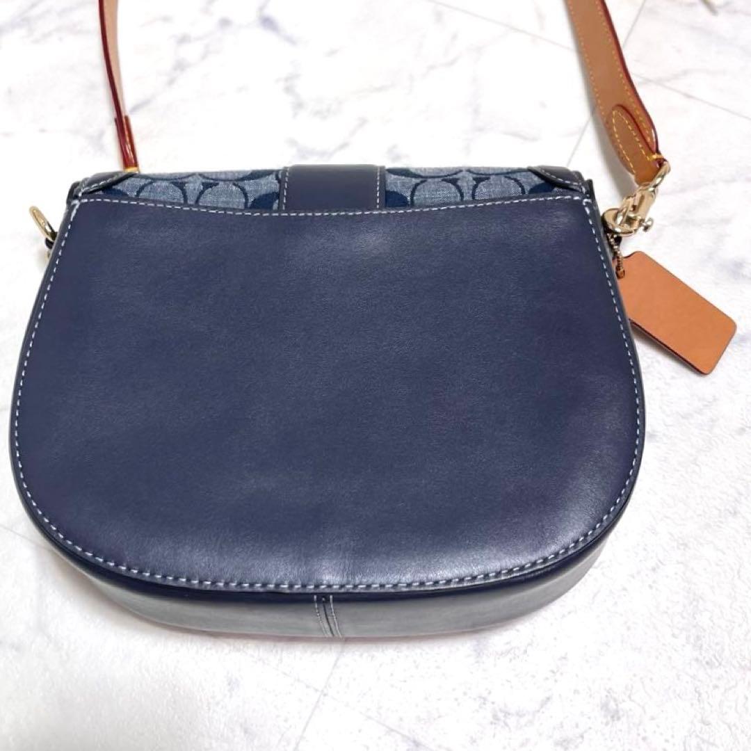 マイメロ✨コーチ ショルダーバッグ ジョージー サドルバッグ シグネチャー