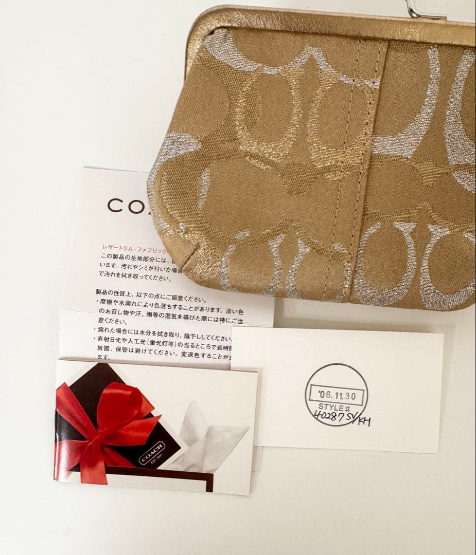 COACH がま口　キスロック　クラッチ　ゴールドラメ　コーチ
