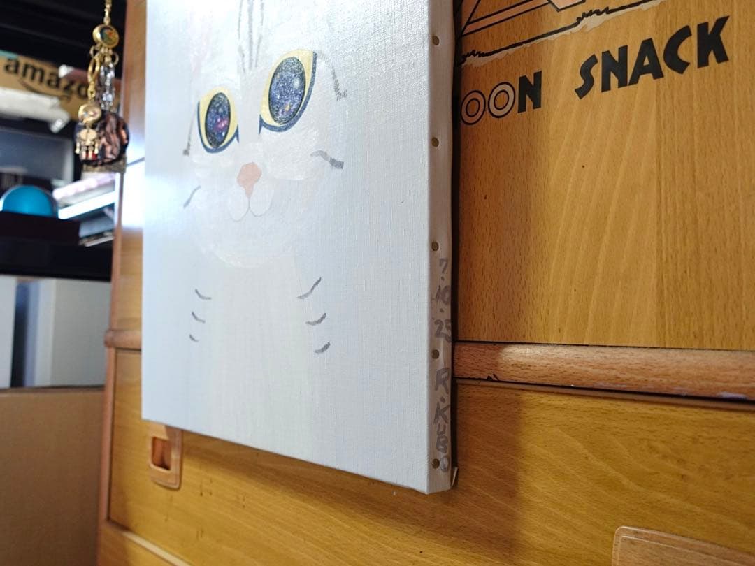 『まる子』　宇宙の目を持つ猫の油絵