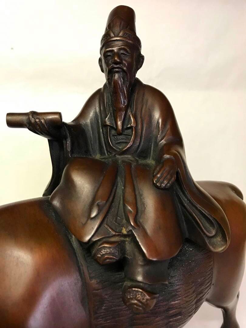 銅製:孔子牛乗図置物