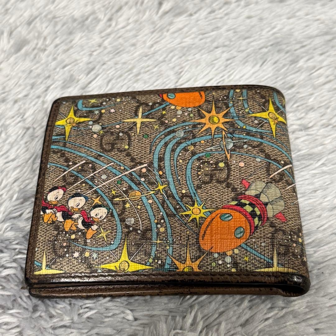 GUCCI Disney 二つ折り財布 ドナルドの通販はau PAY マーケット - 輸入