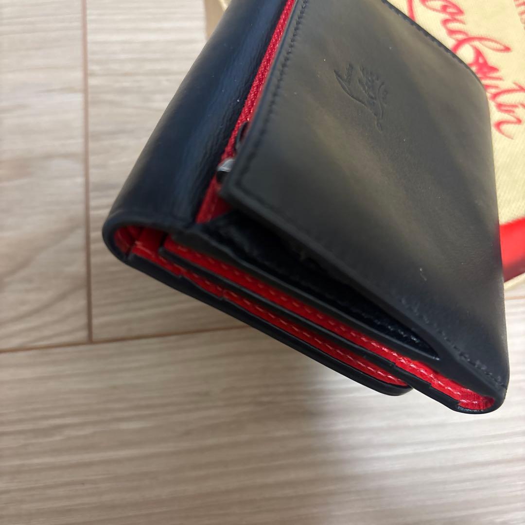 クリスチャン ルブタン スタッズ二つ折り財布 - メルカリ