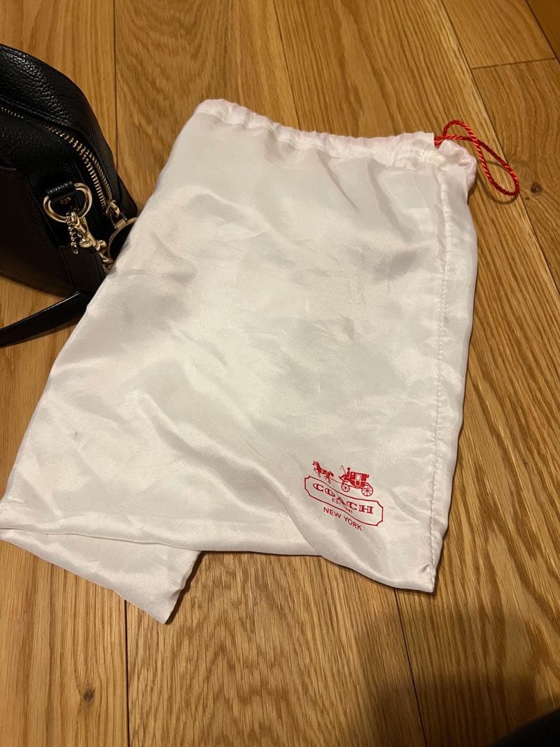 【未使用品】COACH タッセルブラックレザーバッグ