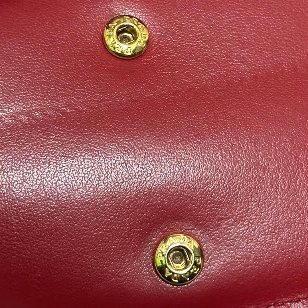 PRADA プラダ　折り財布　ゴールドロゴ　シボ革　バイカラー　赤　黒