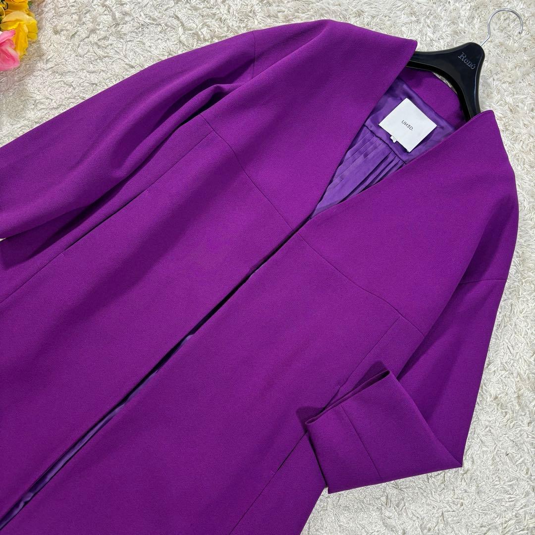 UN3D ノーカラー プリーツ フレア ボタンレス Aライン ロングコート