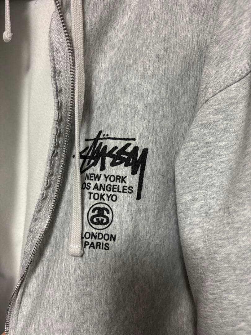 Stüssy グレー パーカー Lサイズ バックプリント