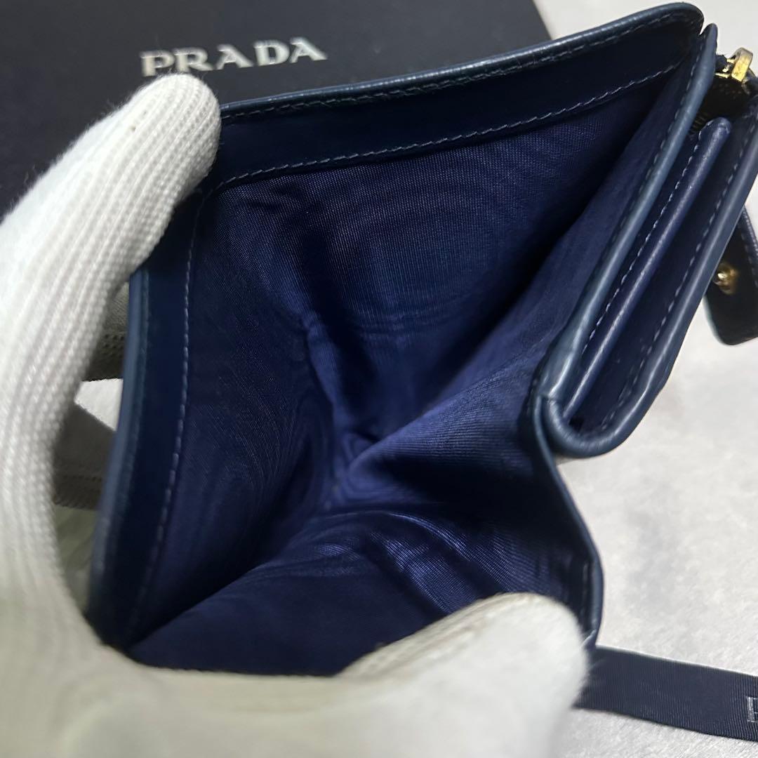 PRADA プラダ 折り財布 ラウンドファスナー ゴールドロゴ ブルーの通販
