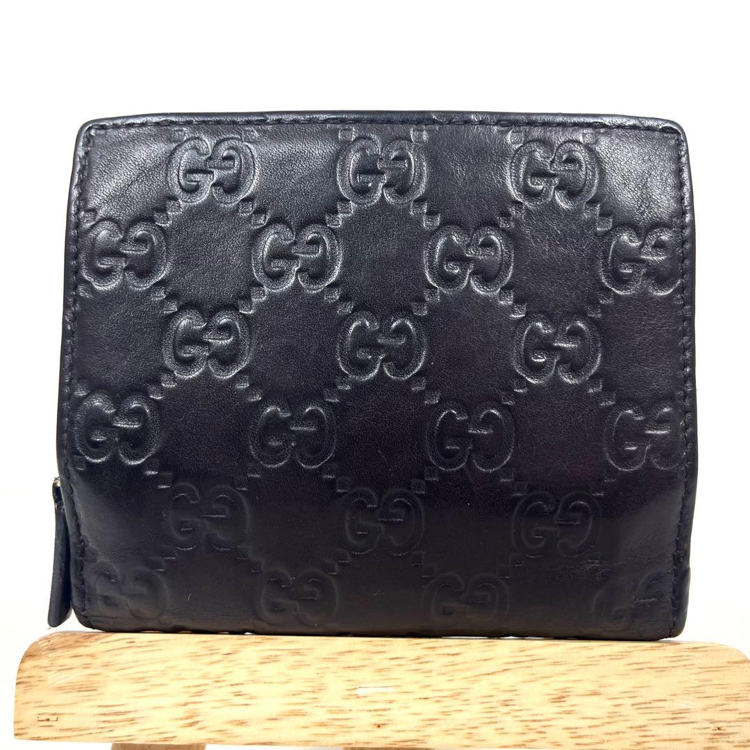 グッチ 二つ折り財布 アビー シマレザー ラウンドファスナー ロゴ エンボス