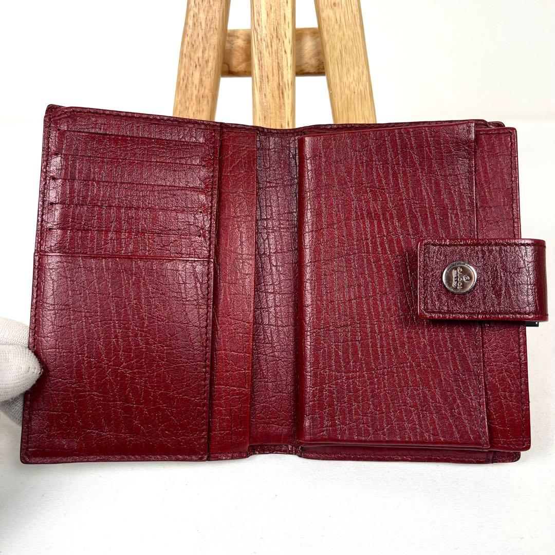 グッチ　折り財布　GGスプリーム　ロゴ総柄　がま口　ミディアム　PVC レザー