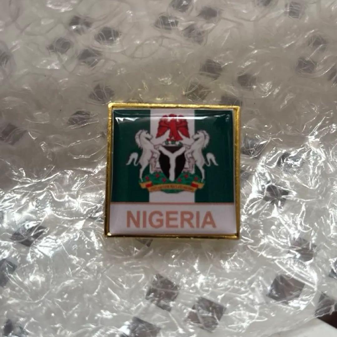 ナイジェリアパビリオンピンバッジ 万博 - メルカリ