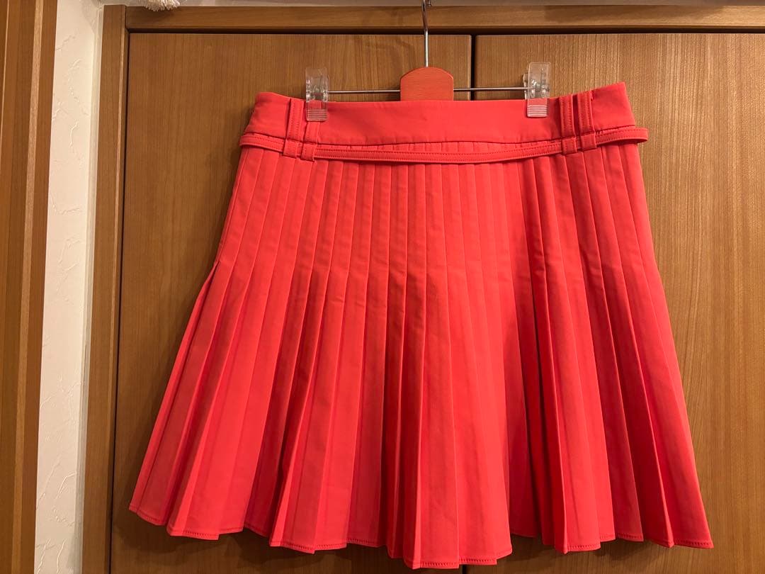 アニユーゴルフ　コーラルピンク プリーツスカート